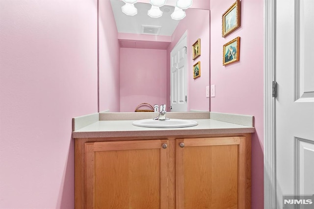 bathroom featuring vanity and visible vents