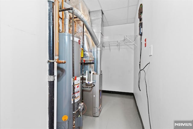 utility room featuring water heater