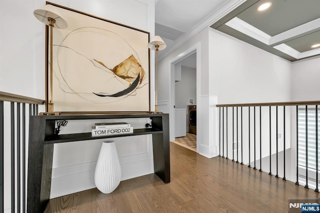 corridor with ornamental molding, washer / clothes dryer, wood finished floors, and recessed lighting