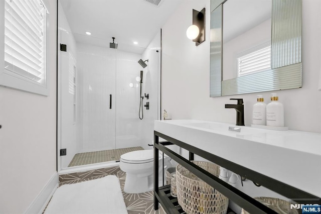 full bathroom with a stall shower, vanity, toilet, and recessed lighting