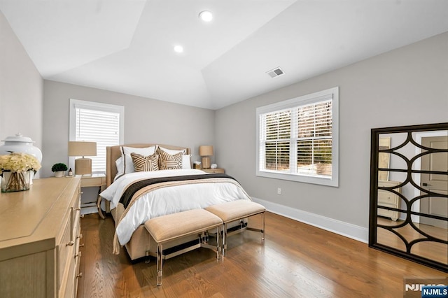 bedroom featuring recessed lighting, visible vents, dark wood-type flooring, vaulted ceiling, and baseboards