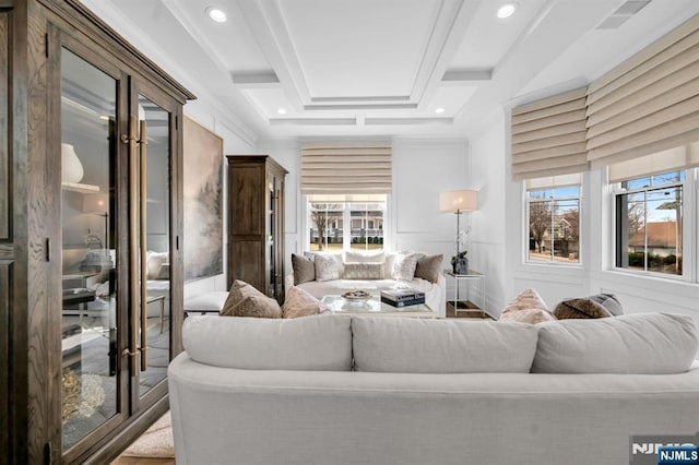 living area featuring recessed lighting and beamed ceiling