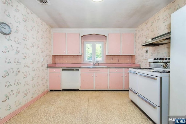 kitchen with light floors, a sink, white appliances, under cabinet range hood, and wallpapered walls