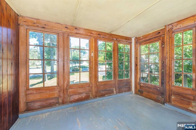 unfurnished sunroom with a healthy amount of sunlight