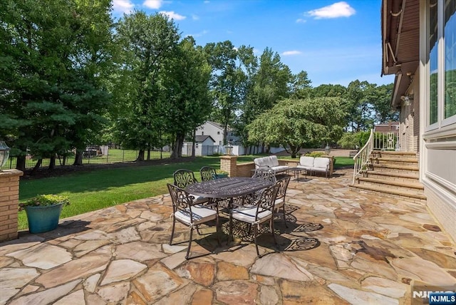 view of patio featuring outdoor dining area and fence