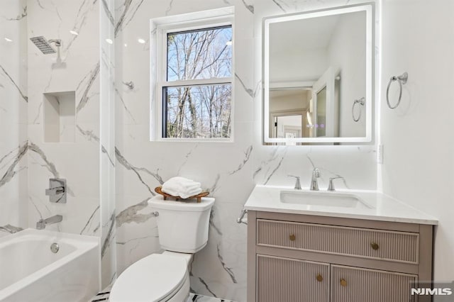 bathroom with vanity, shower / bathing tub combination, and toilet