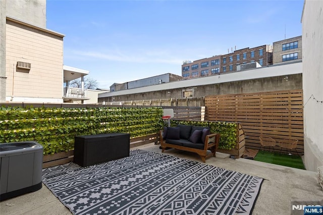 view of patio / terrace with cooling unit and an outdoor hangout area