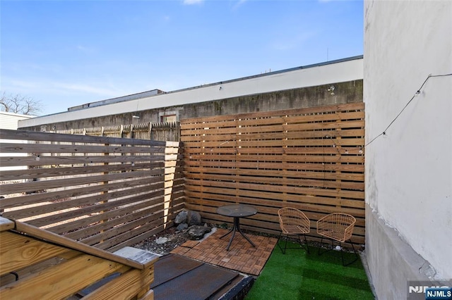 view of patio / terrace with fence