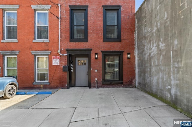 view of front of house featuring brick siding