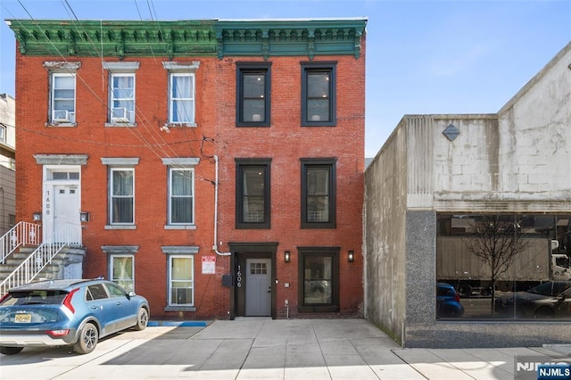 view of property with brick siding