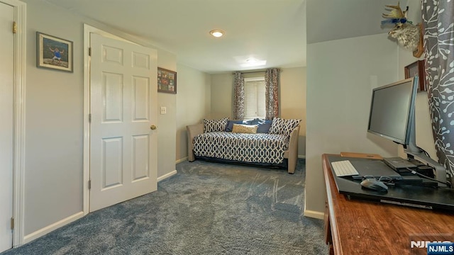 carpeted bedroom featuring baseboards