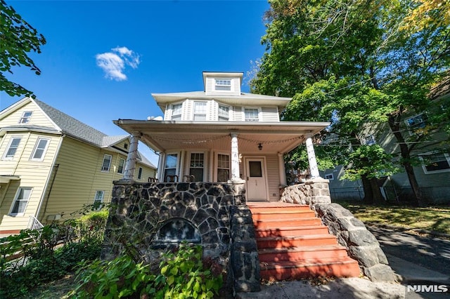 traditional style home with covered porch