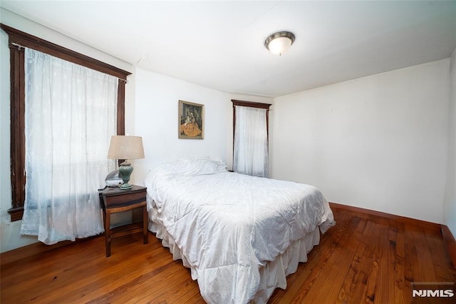 bedroom with wood finished floors