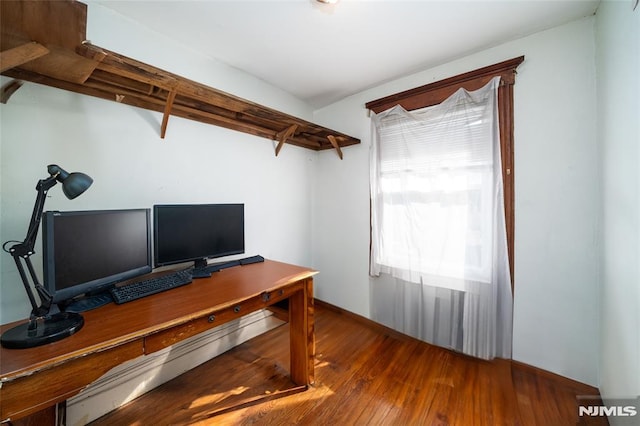 home office featuring hardwood / wood-style floors