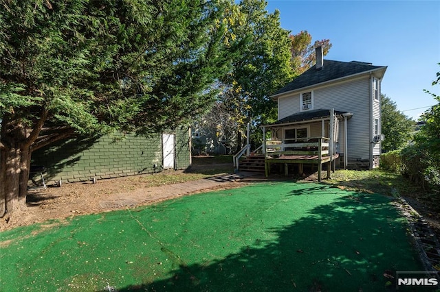 view of yard featuring a wooden deck