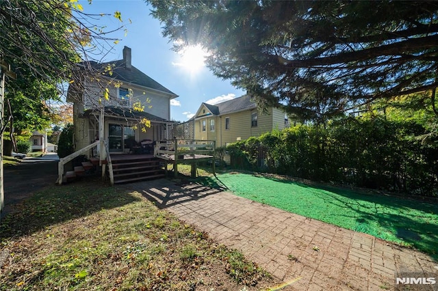 view of yard featuring a wooden deck