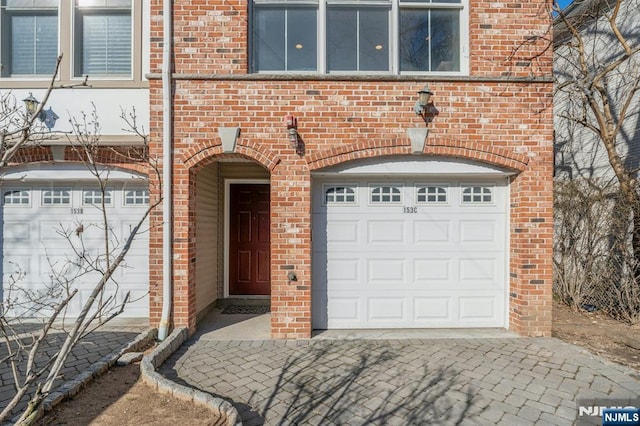 doorway to property with brick siding