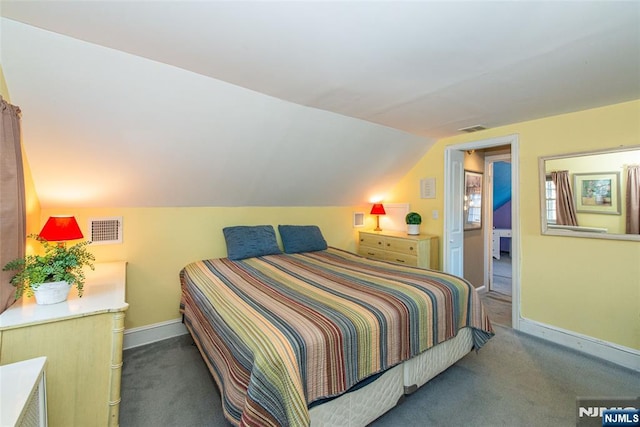 carpeted bedroom featuring visible vents, vaulted ceiling, and baseboards