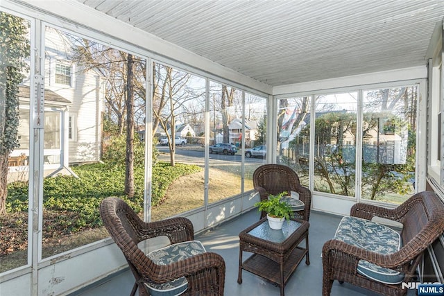 sunroom / solarium with a residential view