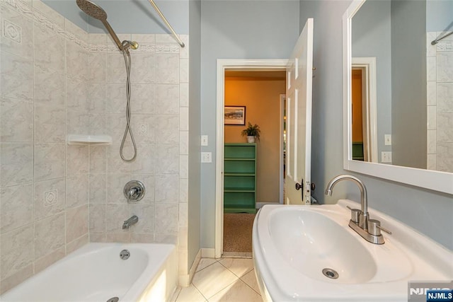 full bath with shower / bath combination, tile patterned flooring, and a sink