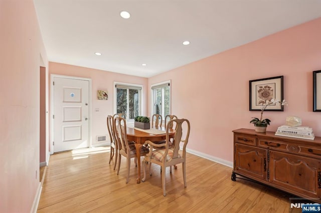 dining room featuring recessed lighting, baseboards, visible vents, and light wood finished floors