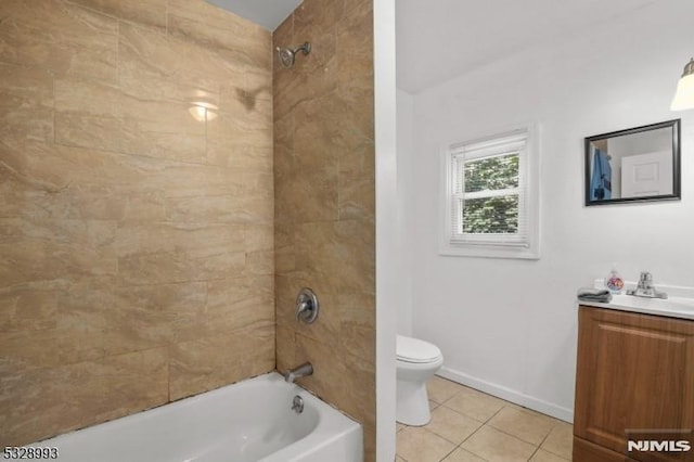 bathroom featuring baseboards, toilet, tile patterned flooring, vanity, and shower / washtub combination