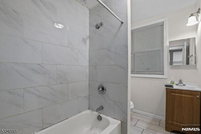 bathroom featuring shower / washtub combination, baseboards, vanity, and toilet