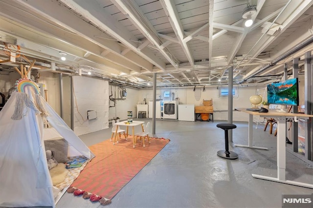 basement with washer and clothes dryer