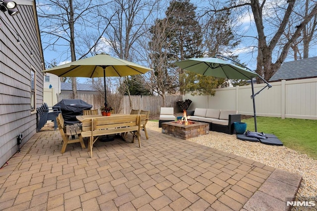 view of patio with an outdoor living space with a fire pit, outdoor dining area, and a fenced backyard