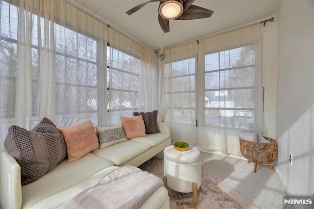 sunroom / solarium with plenty of natural light and ceiling fan