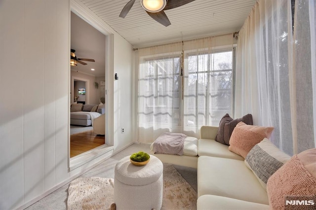 sunroom featuring a ceiling fan