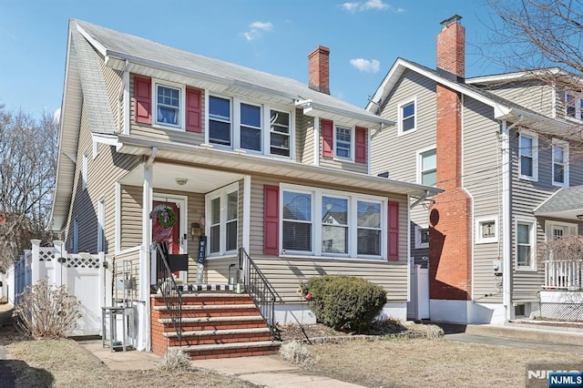 view of front of house featuring fence