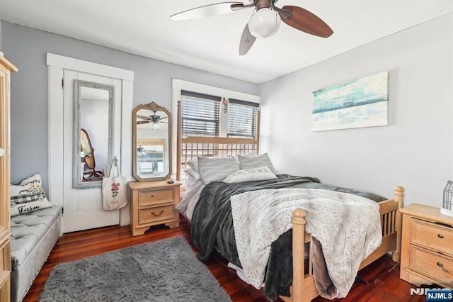 bedroom featuring dark wood-style floors and a ceiling fan