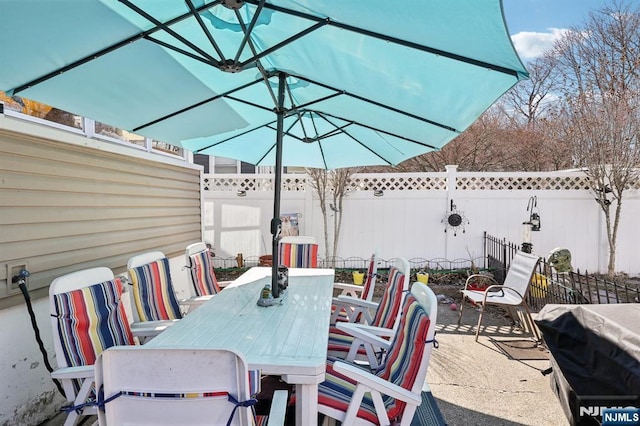 view of patio / terrace featuring outdoor dining space and a fenced backyard