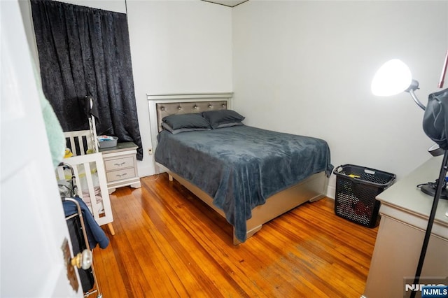 bedroom featuring wood finished floors