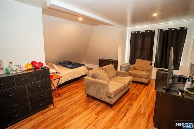 bedroom with light wood-style floors