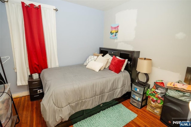 bedroom with wood finished floors