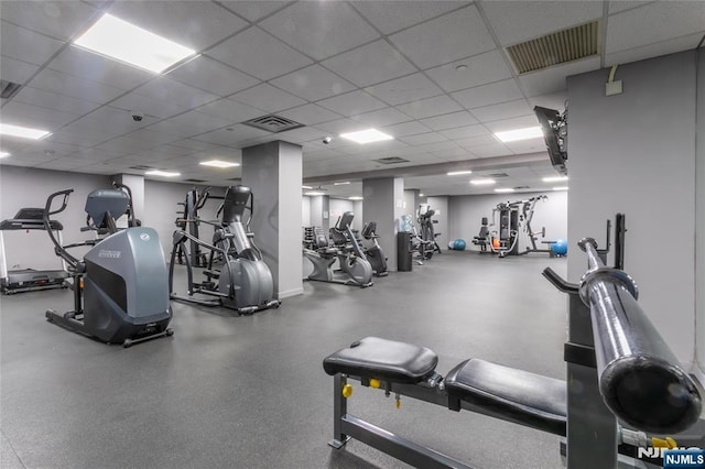 exercise room featuring a drop ceiling
