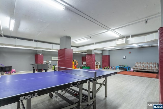 rec room featuring wood finished floors