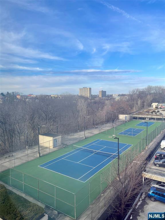 view of tennis court with fence