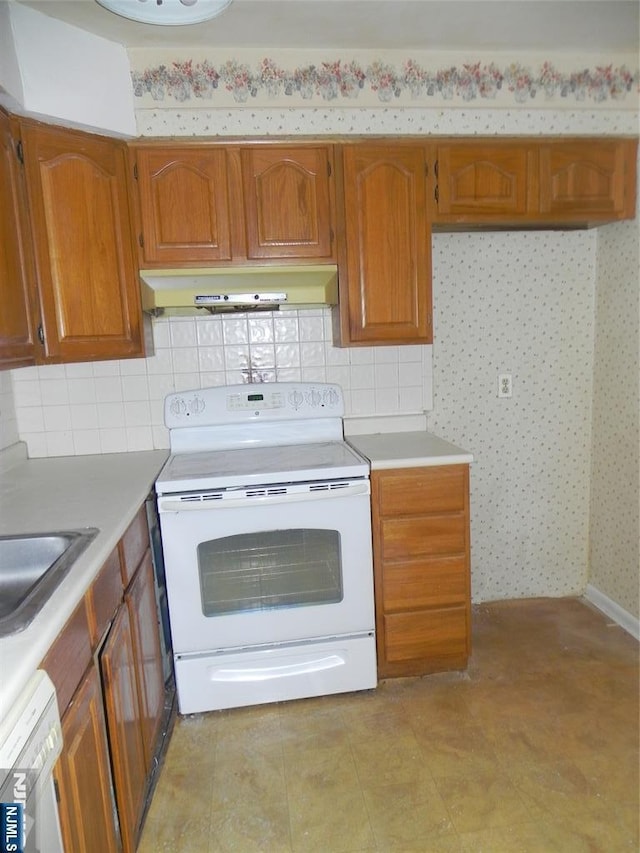 kitchen with brown cabinetry, dishwashing machine, light countertops, white electric range, and under cabinet range hood