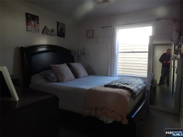 bedroom with tile patterned floors