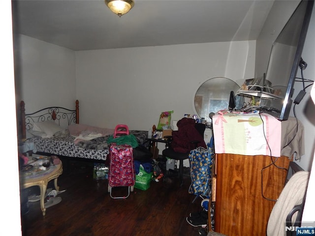 bedroom with wood finished floors