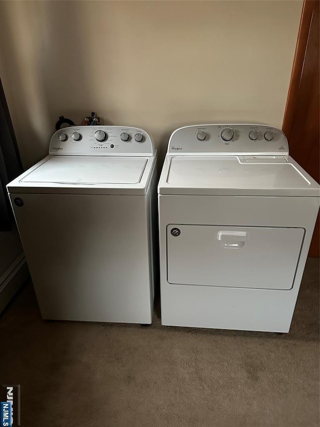 laundry area featuring washer and dryer, laundry area, and carpet