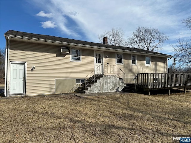 rear view of property with a lawn