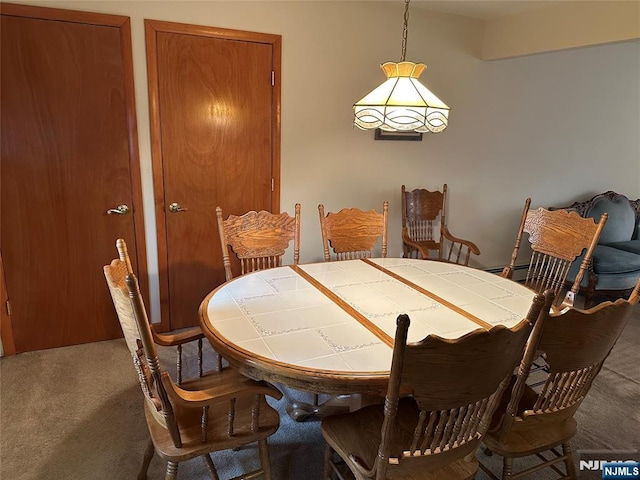 dining area with carpet flooring