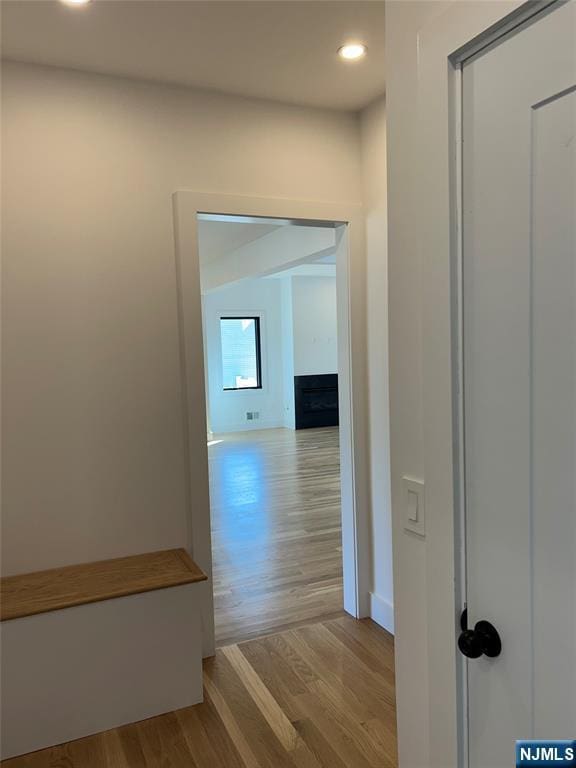 hall featuring recessed lighting and wood finished floors