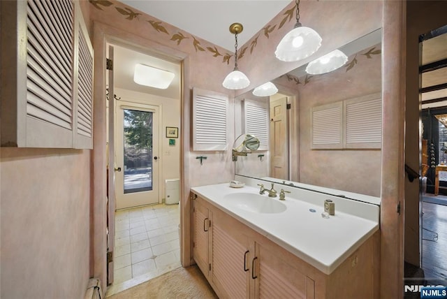 bathroom with tile patterned flooring and vanity