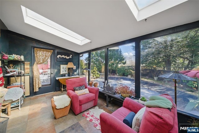 sunroom with lofted ceiling with skylight