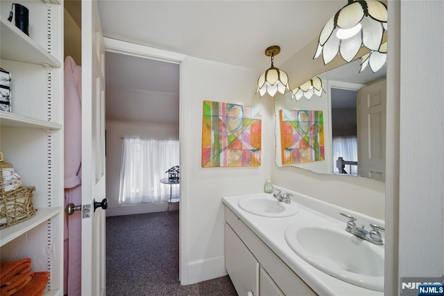 full bathroom featuring a sink and double vanity